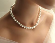 This trendy large pearl necklace is handmade in your choice of vegan white or ivory/cream 10mm pearls. The necklace includes a 3 inch silver figaro chain extension, embellished with a pearl drop, for adjustable sizing. ♥ All jewelry comes in a gift box and is ready to give! ♥ Want to see similar items? There are many more unique items at my shop, including children's jewelry! Back to main shop: http://etsy.me/29ztspj Real Pearl Necklace Vintage, Pearls Backdrop, Ball Jewellery, Big Pearl Necklace, Large Pearl Necklace, Charm Bracelets For Girls, Silver Figaro Chain, Chunky Pearl Necklace, Backdrop Necklace