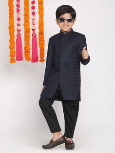 VASTRAMAY Boys Navy Blue Embellished Slim-Fit Sherwani Set Experience the elegance and sophistication with the VASTRAMAY Boys Navy Blue Embellished Slim-Fit Sherwani Set, designed to make your little one stand out on special occasions. This exquisite ensemble offers a perfect blend of tradition and modern style. Key Features Embellished detailing for a regal look Slim-fit design for a contemporary appeal Perfect for festive and ceremonial occasions Specifications Color: Navy Blue Fit: Slim-Fit I Blue Long Sleeve Churidar For Reception, Blue Traditional Wear For Winter Festivals, Blue Traditional Wear For Festive Winter Occasions, Winter Festive Blue Traditional Wear, Festive Nehru Jacket For Party With Straight Kurta, Festive Nehru Jacket For Party, Party Sherwani With Self Design And Fitted Style, Blue Fitted Traditional Wear For Winter, Fitted Party Sherwani With Self Design