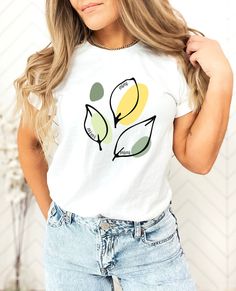 This pretty botanical springy Mimi tshirt is not over the top while still being trendy. It will quickly become the favorite tee for fun times with the grand kids or anytime! It's a great gift idea for Mother's Day or as a pregnancy announcement. Pick one up today for your favorite Mimi or for yourself!  Size and Color This shirt runs true to size. Please review the size and color charts before ordering. Colors may vary slightly from your monitor or phone. The processed used to create your shirt Trendy Plant Print Tops For Spring, Trendy Spring Tops With Plant Print, Trendy Tops With Plant Print For Spring, Casual Green Tops With Plant Print, White Casual T-shirt With Plant Print, Casual White T-shirt With Plant Print, Spring Leaf Print Short Sleeve Tops, Trendy Cotton T-shirt With Plant Print, Everyday Floral Print Short Sleeve Top