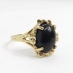 Vintage 14k gold marquise onyx ring with a modernist design oval cut onyx has been set into the 10k gold ring this ring is a size 6 the band at the back of the ring is 1.9mm the face of the ring is 13.5mm x 11.8mm weight of the ring is 2.62 grams onyx stone measures 10.1mm x 7.7mm and is 2 carats this ring is marked Spring 14k Black Oval Opal Ring For Formal Occasions, Black Cabochon Ring In 14k Gold, Black 14k Gold Cabochon Ring, Black Cabochon 14k Gold Rings, 14k Gold Black Cabochon Rings, Formal Oval Onyx Rings, 10k Gold Ring, Baby Rings, Gold Diamond Band