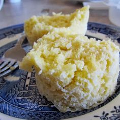 two pieces of cake sitting on top of a blue and white plate