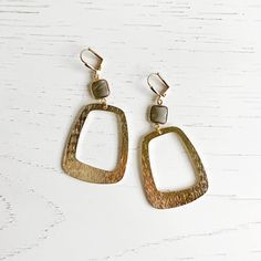 This season, glow for gold in this statement pair with trendy geometric shapes. GEMSTONE: Smokey quartz MATERIAL: Brass CLOSURE: Gold plated leverback LENGTH: 2.75" long Gold-tone Long Drop Brass Earrings, Gold-tone Brass Earrings With Polished Finish, Gold Smoky Quartz Gemstone Jewelry, Brown Smoky Quartz Gemstone Jewelry, Luxury Gold Smoky Quartz Jewelry, Rectangle Earrings, Smokey Quartz, Geometric Earrings, Gems Jewelry