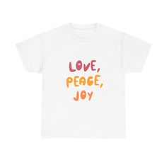 A Love, Peace, and Joy Graphic T-shirt that exudes positivity and warmth. Perfect for those who value spreading good vibes and embracing a message of love and peace. Ideal for casual wear and can be paired with jeans or leggings for a relaxed look. Relevant for occasions like Valentine's Day, Pride Month, or simply to uplift spirits any day. Product features - Shoulder tape for stability - Ribbed knit collar for shape retention - Made from strong and smooth fabric - Classic fit for comfy wear - Ethically grown and harvested US cotton Care instructions - Machine wash: warm (max 40C or 105F) - Non-chlorine: bleach as needed - Tumble dry: medium - Do not iron - Do not dryclean Peace And Joy, Love And Peace, Comfy Wear, Inspirational Shirt, Love Peace, Pride Month, Love Messages, Knit Collar, Positive Vibes