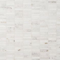 a white marble tile wall that is very large