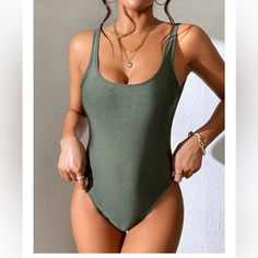 Nwt Dixperfect Olive Green Malibu Retro Fit Swimsuit Trendy Solid Color Bodysuit For Pool, Trendy Bodysuit For Pool, Trendy Solid Color Bodysuit For The Pool, Casual Sleeveless Lined One Pieces, Casual One-piece Bodysuit For Pool, Casual Solid One-piece Swimsuit, Casual Solid Swimwear With Lined Body, Casual Sleeveless Bodysuit For Pool, Casual Green Bodysuit With Lined Body