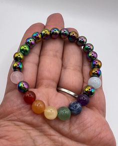 Pride Bracelets, made with multi stones to represent the lgbtq flag colors, including rainbow hematite, which provides focus balance and clarity of thought. Aiding in self esteem. Rainbow Crystal Bracelet With Gemstone Round Beads, Rainbow Crystal Bracelet With Natural Stone Round Beads, Rainbow Crystal Bracelet With Natural Stones And Round Beads, Rainbow Crystal Bracelet With Round Gemstone Beads, Rainbow Crystal Bracelet With Natural Stones, Multicolor Polished Beaded Bracelets For Meditation, Adjustable Multicolor Beaded Bracelets, Multicolor Polished Beads Bracelet For Meditation, Spiritual Rainbow Bracelets With Round Beads