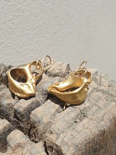 This is a beautiful 14 karat gold plated brass earrings. A broken sea shell shape earrings.  a rustic statement earrings in a matt finish. All my gold plated earrings are made with a post made of 14K Goldfilled ( This material contains 100 times more gold than gold-plated wire, it  is very durable, and looks gorgeous like solid gold) it is very safe to people with sensitive ears.-Gold plated brass-14 karat gold plating-free shipping worldwide-gift boxTo see more of my Earrings. please follow thi Unique Gold Shell Earrings, Handmade Gold Shell-shaped Earrings, Sea Shell Earrings, Gold Shell Drop Earrings, Ocean-inspired, Gold Dangle Shell Earrings Ocean-inspired, Bohemian Gold Shell-shaped Earrings, Women Earrings, Gifts Fo, Gem Ring