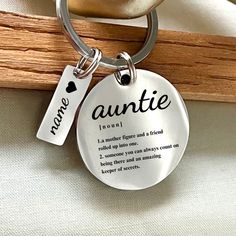 a keychain with a name tag attached to it's front and back