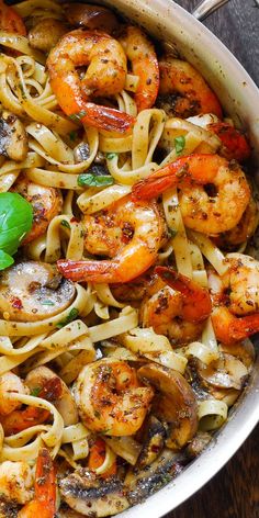 pasta with shrimp and mushrooms in a pan