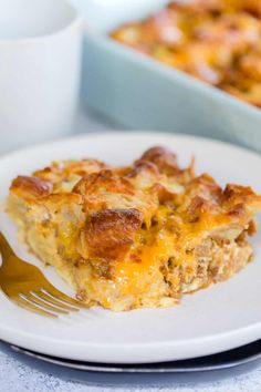 a white plate topped with a piece of casserole