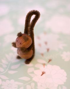 a toy monkey sitting on top of a table