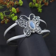 Butterfly Bangle Handmade Blue Opal Gems 925 Sterling Silver Cuff Bracelet Women's Gift Jewelry Type:- Cuff Bangle Product weight:- 24.70gm (approx) Stone:- Blue Opal Stone Size:- 5 x 11mm (approx)  Stone Shape:- Marquise Metal:- 925 Sterling Silver Metal:- IG925     Bangle Diameter:- 62 mm, 2.5 Inch ➤VIEW MORE PRODUCTS------------------------------ ☛RING https://etsy.me/443XLl4 ☛EARRING https://etsy.me/3JhUOUe ☛PENDANTS https://etsy.me/43YCsRQ ☛BRACELETS https://etsy.me/3JjW3Cl ☛NECKLACE https: Elegant Blue Sterling Silver Cuff Bracelet, Blue Sterling Silver Cuff Bracelet With Gemstone, Bohemian Sterling Silver Cuff Bracelet For Weddings, Bohemian Sterling Silver Wedding Cuff Bracelet, Elegant Blue Bangle As Gift, Formal Blue Gemstone Cuff Bracelet, Blue Cuff Bracelet For Wedding, Adjustable Sterling Silver Bangle For Wedding, Sterling Silver Gemstone Bracelets For Weddings