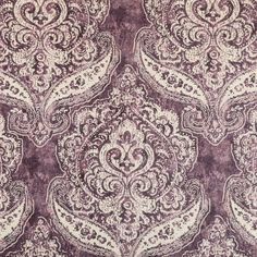 a purple and white rug with an intricate design