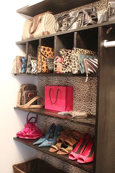 the shoe rack is filled with many pairs of shoes and purses, all in leopard print