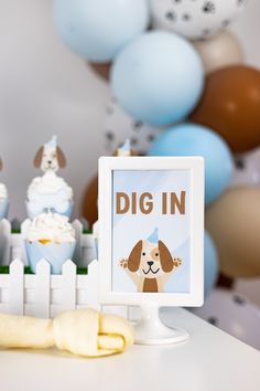 a white table topped with cake and cupcakes