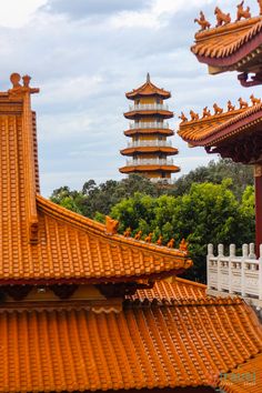 an orange roof with pagodas in the background