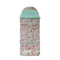 a small child's sleeping bag with polka dots on it