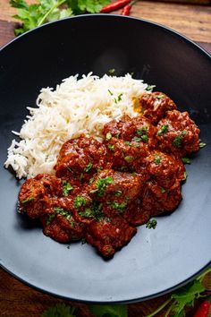 meat and rice in a bowl on a table