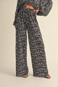 Introducing our Leopard Wide Pants, made from a soft and comfortable crinkled fabric in a bold wild leopard print. Enjoy the stylish wide leg design while feeling comfortable all day long. Complete the look with the matching top (sold separately). Crinkled Fabric, Wild Leopard, Leg Design, Wide Pants, Matching Top, New Tops, Sale House, Denim Dress, Leopard Print