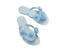 Let your little one's sense of style bloom in the Harmonic Springtime flip flops. With a trio of flower appliqués front and center, these embellished flip flops bring a feminine flair to a functional favorite. Just slip these on when heading to the pool, beach and beyond. Blue Flip Flops For Spring Pool Season, Trendy Flower Sandals For Beach, Adjustable Sandals For Pool And Spring Season, Spring Flat Flip Flops For Pool, Spring Pool Flip Flops, Flat, Spring Pool Flat Flip Flops, Spring Pool Blue Sandals, Blue Sandals For Pool Use In Spring Season, Blue Sandals For Pool In Spring Season