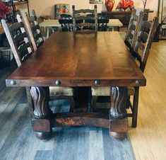 a large wooden table with chairs around it