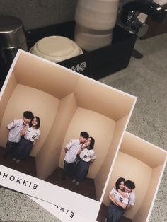 two polaroid pictures of a couple hugging each other in a room with coffee mugs on the counter