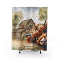 a shower curtain with an image of a highland cow in front of a rustic barn