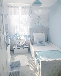 a bedroom with white walls and blue accents