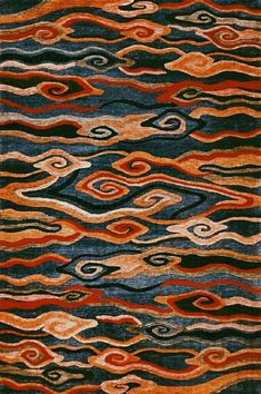 an area rug with different colored waves on it