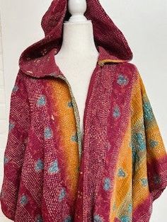 This Kantha Coats is a gorgeous poncho design featuring 3 layers of fine Kantha embroidered saree. Fully reversible, in a patchwork multi color print , BUT remember to remove the brand tag sewn in the neckline.Style is casual, worn for outdoor events, flexible for multi purpose use. Suitable for the office, lunches, beach, sailing, etc. Worn as a duster, no closures, designed to be worn loose. May add belt if prefered. Designed to be loose and flowing. Generous cut. One-of-a-kind, unisex, one si Traditional Multicolor Shawl Outerwear, Winter Festive Multicolor Dupatta, Festive Multicolor Winter Dupatta, Multicolor Cape Shawl For Festival, Bohemian Multicolor Dupatta One Size, Bohemian Multicolor Dupatta, Multicolor Shawl-style Outerwear For Festival, Multicolor Shawl For Festival, Traditional Multicolor Cape For Fall