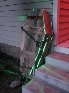 a bag is chained to the side of a house with chains on it's sides