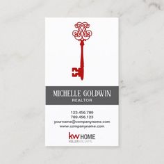 a real estate agent business card with a key to the house on it's front