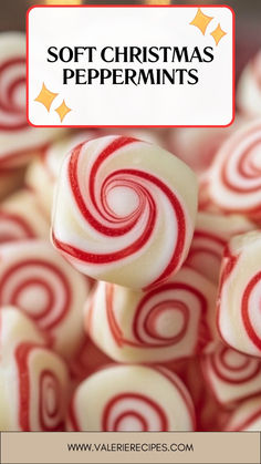 a pile of red and white lollipops sitting on top of each other