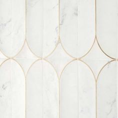 white and gold wallpaper with arched design