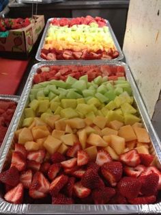 several trays filled with different types of fruit