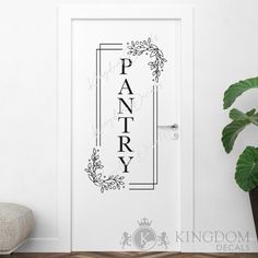 a door with the word pantry painted on it and a potted plant next to it