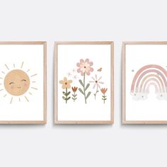 three framed art prints with flowers, sun and clouds