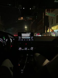 the dashboard of a car at night time