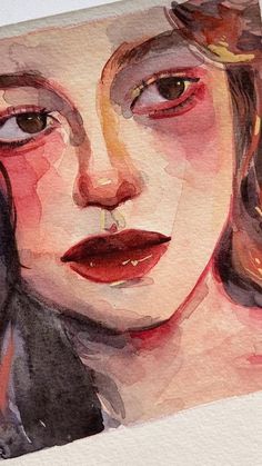 a watercolor painting of a woman's face