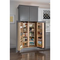 an open pantry cabinet in a kitchen with wood floors and gray cabinets, including the doors opened