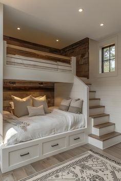 a white bed sitting under a wooden staircase