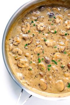 a pot filled with mushroom soup on top of a stove