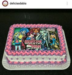 a birthday cake with monster high characters on it