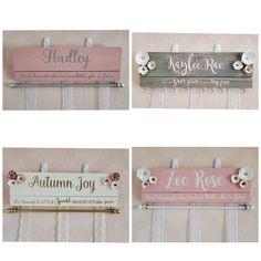 four wooden signs hanging on the wall with name tags attached to them, all in different styles and colors