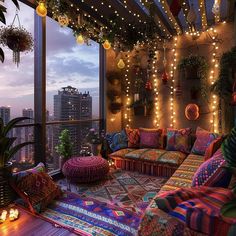 a living room with lots of colorful pillows and lights on the ceiling, along with potted plants