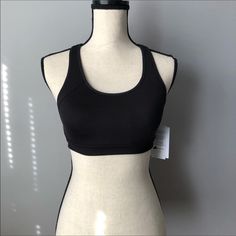 Condition: New Size: X-Small Color: Black, White, And Gray For Reference: Mannequin Bust Size Is 34 1/2in Never Been Worn, In Perfect Condition. From Smoke/Pet Free Home * Reasonable Offers Always Welcomed * Stretch Racerback Sports Bra, Black Bra-friendly Tank Top For Light Exercise, Stretch Racerback Sports Bra For Sports Season, Black Seamless Tank Top For Sports, Black Tank Top For Light Exercise, Fitted Go-dry Sports Bra, Fitted Black Tank Top With Light Support, Black Stretch Racerback Sports Bra, Fitted Racerback Sports Bra For Workout