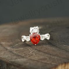 Heart Kitty Inspired Ring *925 Silver Kitty Ring *Japanese Cartoon *Animal Lover Jewelry *Novelty Ring *Heart Garnet Ring *Cat Lover Gift Main Stone: Garnet ( Lab-Created ) Main Stone Color: Red Main Stone Shape: Heart Stone Size- 4X2 MM S I L V E R J E W E L R Y C A R E Silver is not the best friend of oxygen and sulfur; it can be oxidized and tarnished from time to time it is the nature of silver. To keep the silver shiny and prevent it from oxidizing fast, we would recommend the following ins Ring Cat, Lover Jewelry, Ring Heart, Heart Stone, Fancy Gifts, Cat Ring, Japanese Cartoon, Garnet Ring, Cat Lover Gift