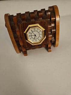 a wooden watch with a clock face on it