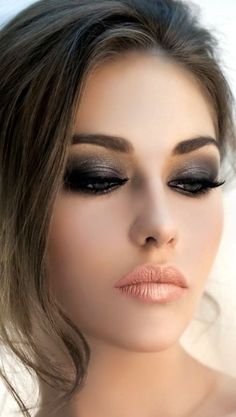 a woman's face with black and white makeup