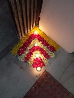 flowers and candles are placed on the ground